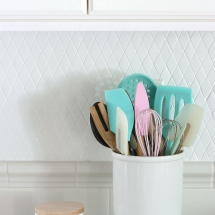 Here is a money saving DIY trick for changing your tile backsplash!  All you need is some paint and time!  Read on to find out what I used for my painted tile backsplash.  You'll totally be surprised at the transformation!